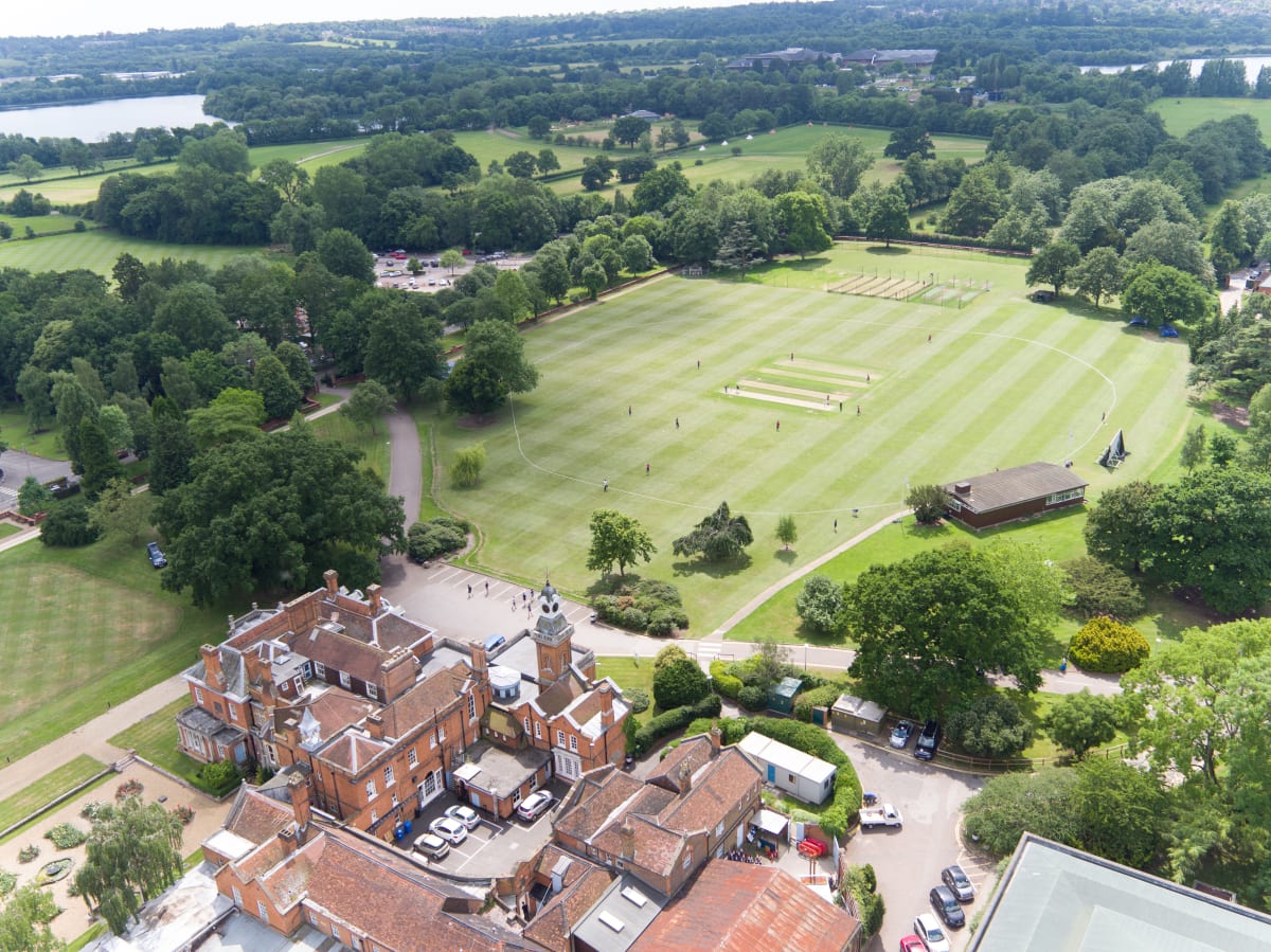 Aerial view of the Haberdashers' Boys' School cricket pitches and pavilion, Elstree